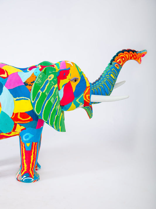 Colorful elephant sculpture on a white background
