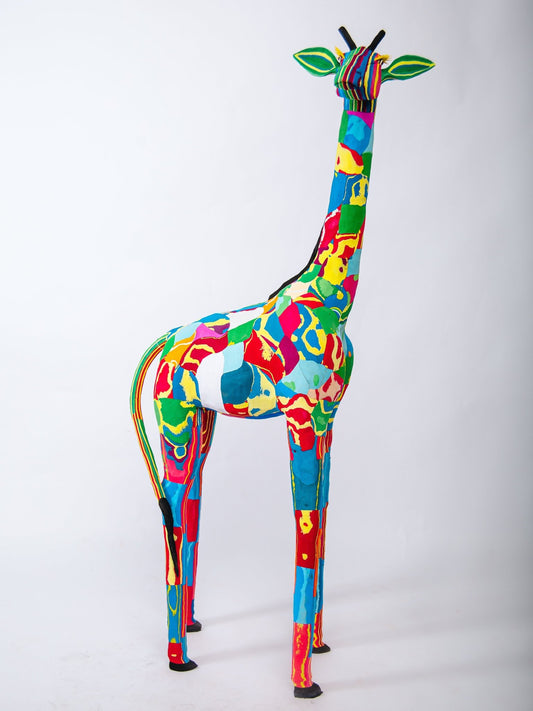 Colorful giraffe sculpture on a white background