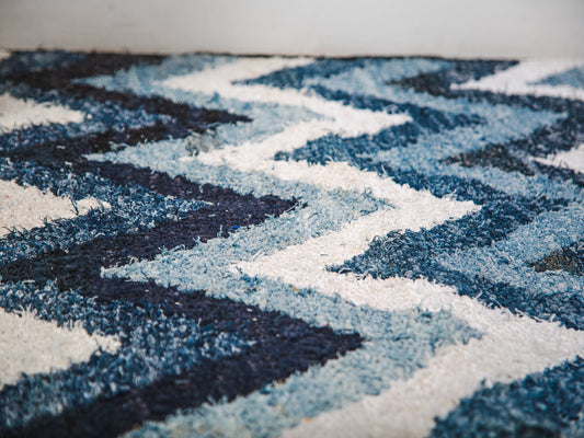 Close-up of a blue and white patterned rug