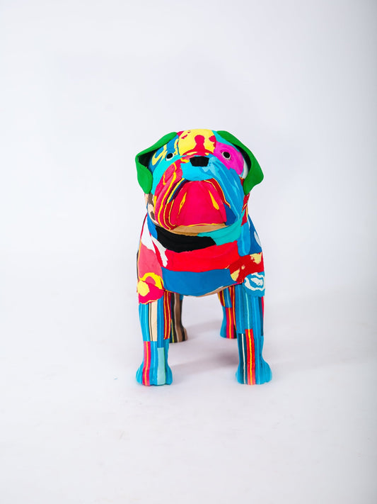 Colorful dog-shaped sculpture on a white background