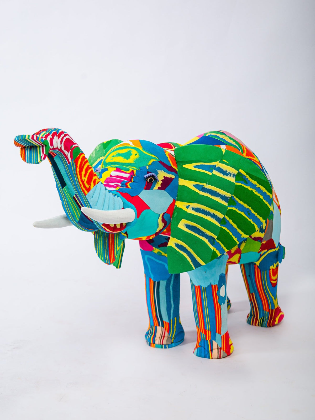 Colorful elephant sculpture on a white background