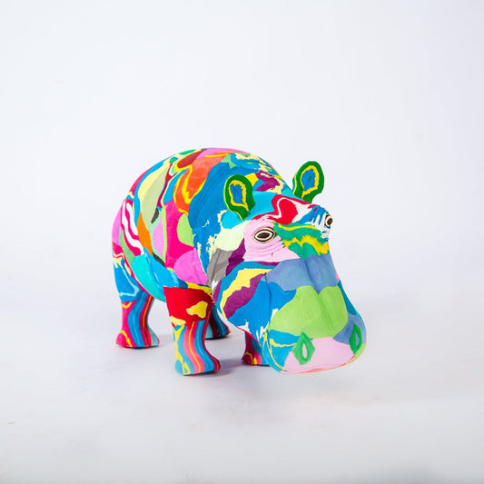 Colorful hippopotamus sculpture on a white background