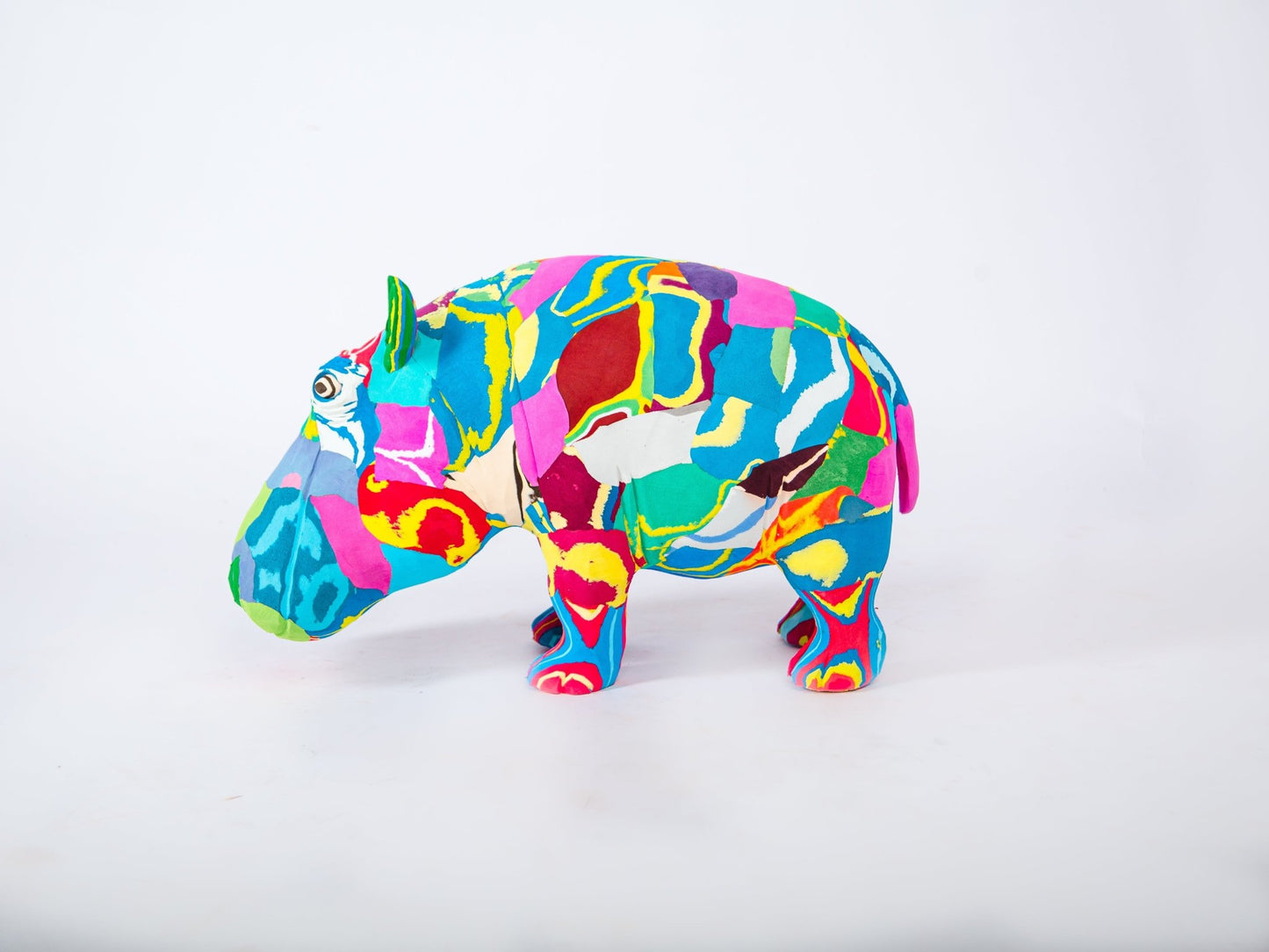 Colourful hippo sculpture on a white background