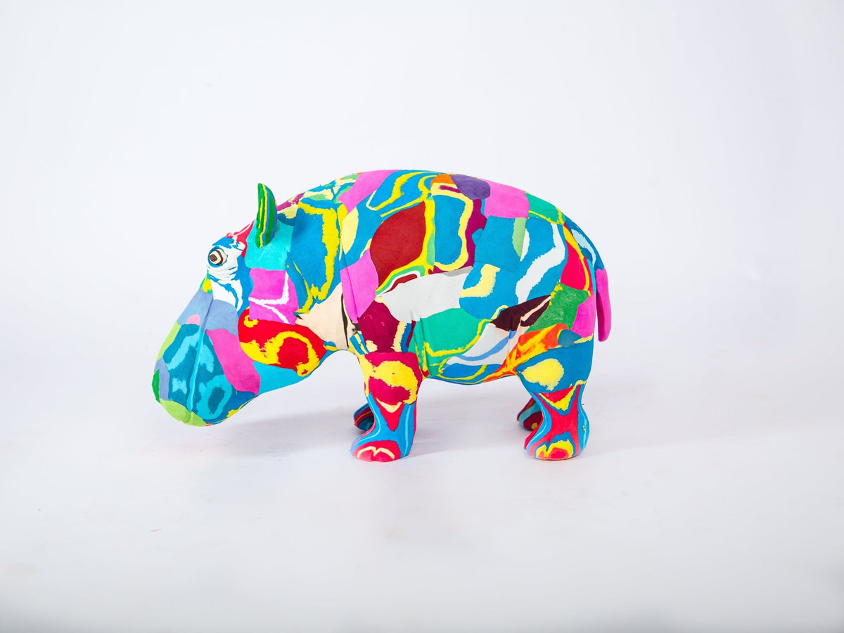Colourful hippo sculpture on a white background