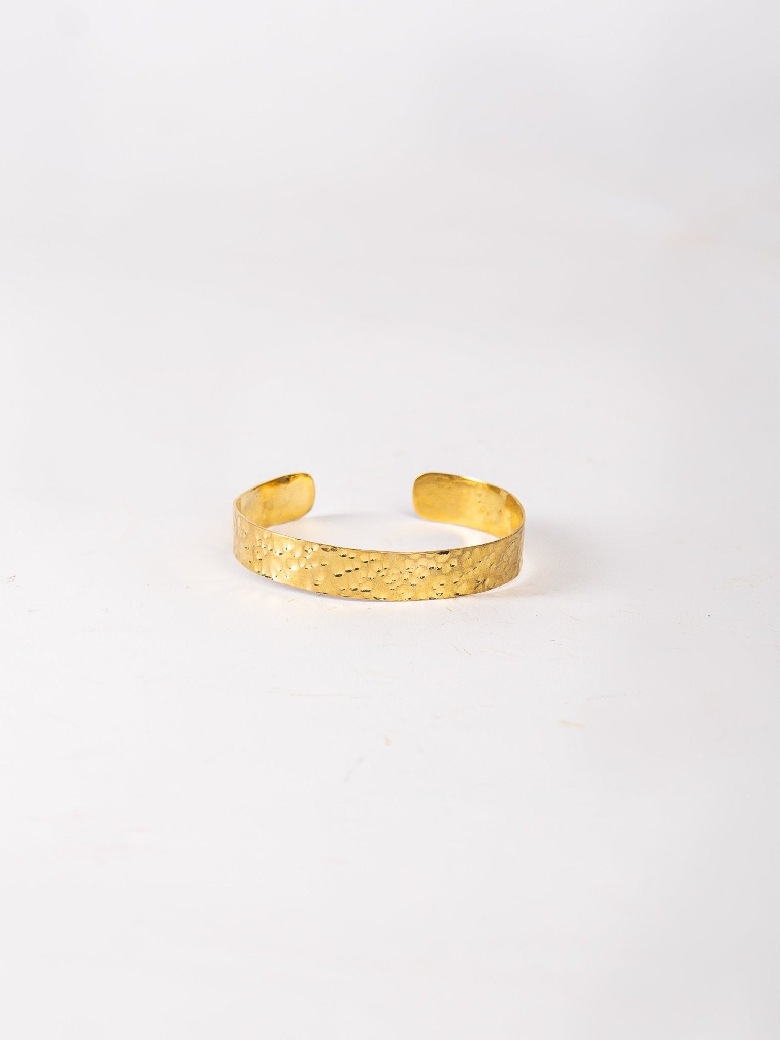 Gold bracelet on a white background