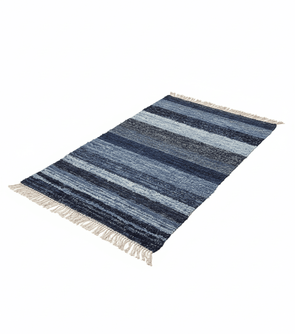 Striped blue rug with white fringe on a white background