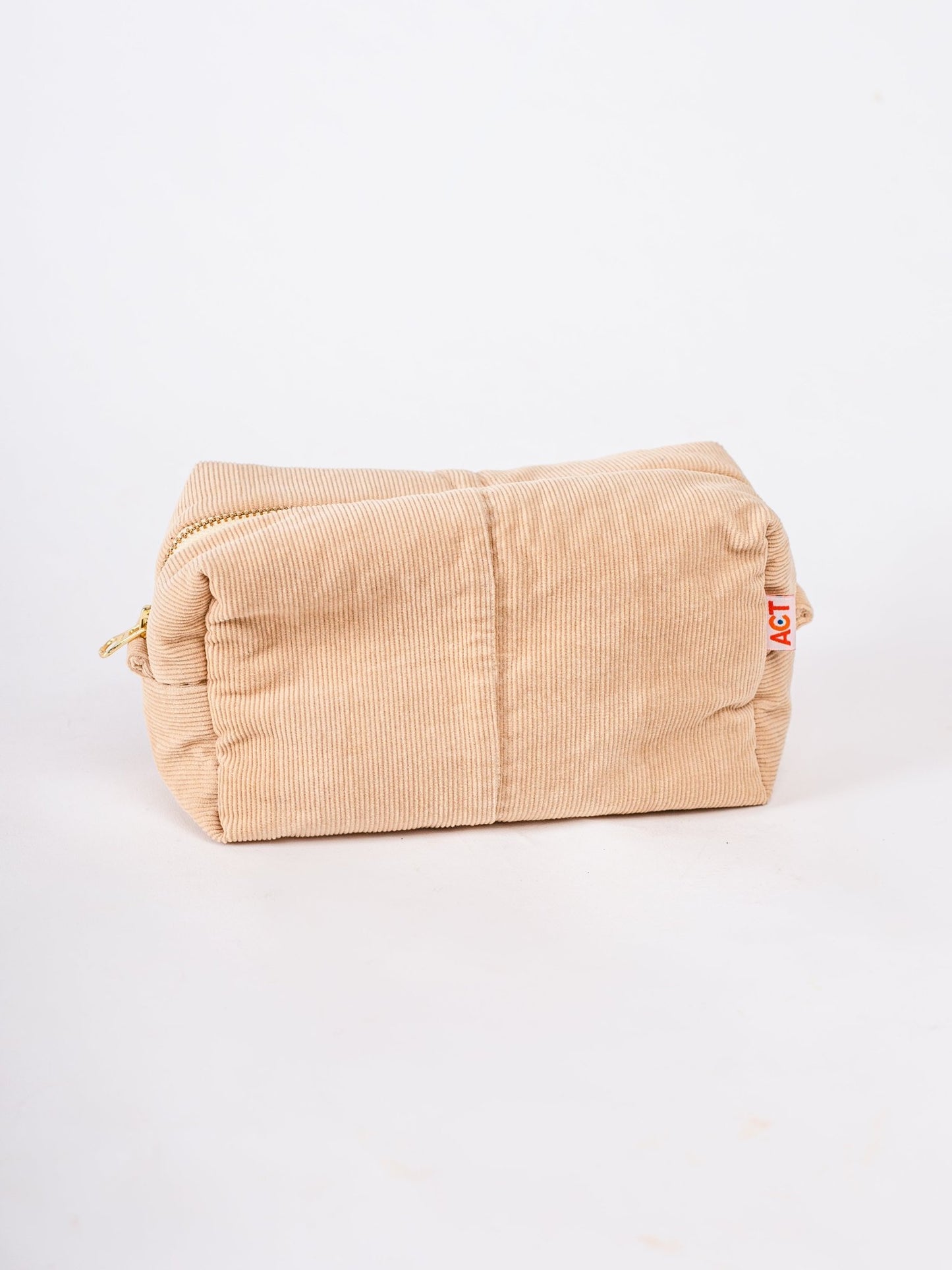 Beige corduroy pouch with a zipper on a white background