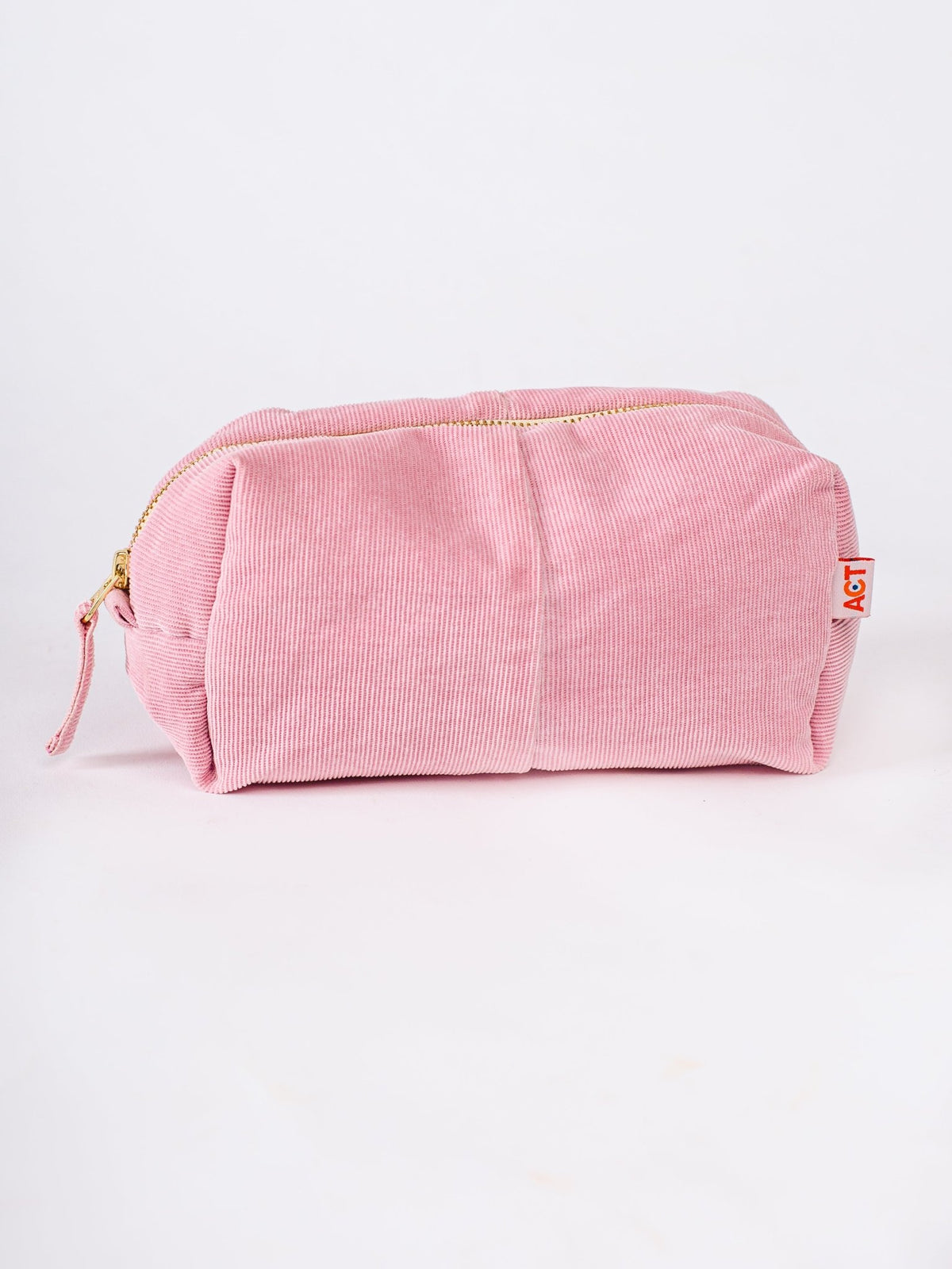 Pink corduroy pouch with a gold zipper on a white background