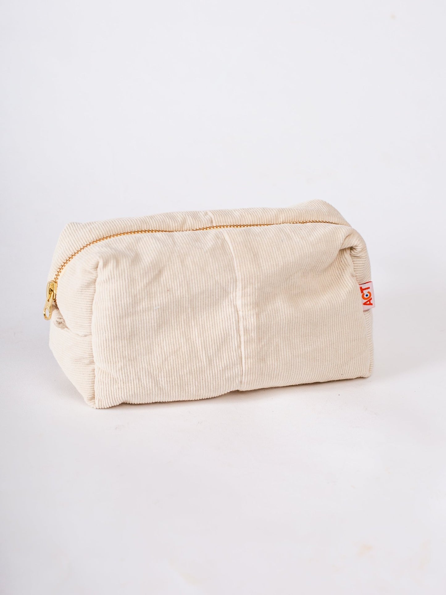 Beige toiletry bag with a brand logo on a white background